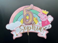 a pink and gold birthday cake topper for a girl