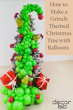 a christmas tree made out of balloons with the words how to make a grin - themed christmas tree with balloons