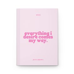 a pink book with the words, everything i desired comes my way