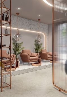 the interior of a modern living room with sofas, chairs and plants on display