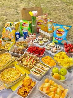 a table topped with lots of different types of food and snacks on top of it