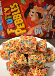 cereal bars are stacked on a plate next to a bag of peeps pop candy