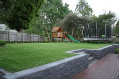 the backyard is clean and ready to be used as a children's play area