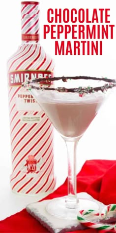 chocolate peppermint martini in a coupe glass next to a bottle of vodka and candy canes