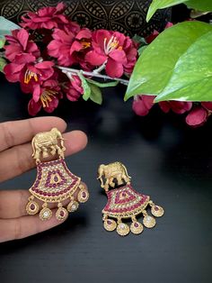 Beautiful antique gold finished elephant kemp earrings for your ethnic party wear dresses! These earrings weigh about 1 oz. Product care: Avoid contact with Chemicals such as Perfumes or any Sprays. Prevent the Jewellery from the water. Use Butter Paper or Cotton Cloth to store your Jewellery for a longer Product life. Bollywood Zari Work Earrings For Puja, Temple Style Zari Work Jhumkas For Parties, Festive Earrings With Zari Work For Puja, Festive Zari Work Earrings For Puja, Red Zari Work Earrings For Diwali, Party Temple Jewelry Earrings With Zari Work, Temple Jewelry Earrings With Zari Work For Party, Traditional Red Earrings With Zari Work, Temple Jewellery Earrings