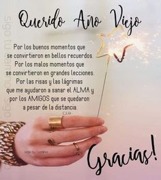 a person holding a sparkler in their hand with the words gracias written below it