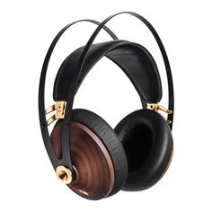 the headphones are made out of wood and black leather with gold trimmings