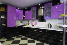 a kitchen with black and white checkered flooring, purple cupboards and cabinets