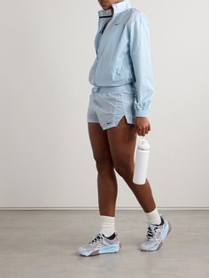 Nike's 'Running Division' shorts are part of a coordinating set with the matching jacket in our edit, and you can just as easily wear them with a tank or hoodie. They're made from panels of water-repellant crinkled-shell and have reflective pinstripes and an elasticated waist. The mesh briefs ensure comfortable coverage. Nylon Sportswear Shorts For Beach, Blue Nylon Water Sports Shorts, Blue Nylon Running Shorts, Sporty Nylon Shorts With Built-in Shorts, Blue Nylon Sportswear Shorts, Nike Windrunner, Nike Set, Nike Short, Sport Swimwear