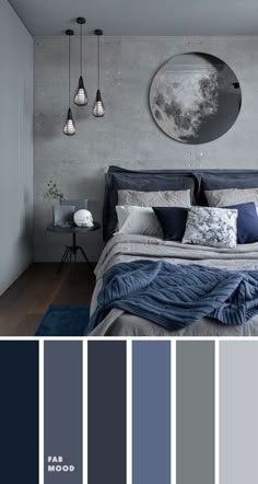 a bedroom with gray walls and blue bedding