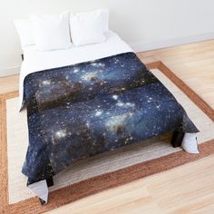 a bed covered in a blanket with stars on it