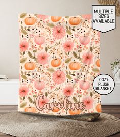 this is an image of a kitchen towel with flowers and pumpkins on it