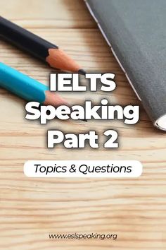 two pencils sitting on top of a wooden table next to a notebook with the words ielts speaking part 2