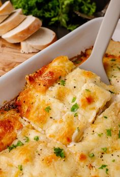 a casserole dish with cheese and parsley