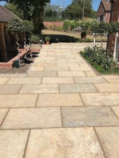 a large stone walkway in the middle of a yard