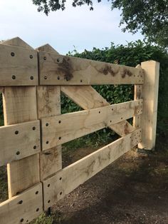 a wooden fence with holes in it