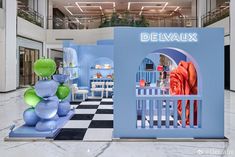 the entrance to delvaux is decorated in blue and green