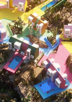 an aerial view of colorful houses in the desert