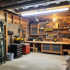 a garage filled with lots of tools and workbench on top of wooden shelves