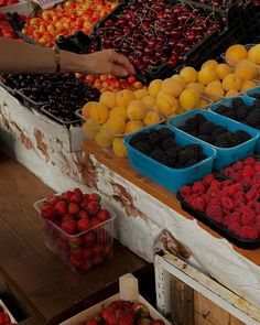 the fruit stand has many different types of berries