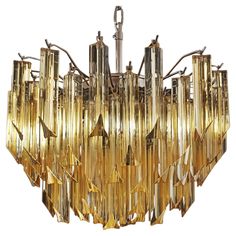 Fantastic vintage Murano chandelier made by 107 Murano crystal clear amber prism triedri in a nickel metal frame. Period: 1980'S Dimensions: 41,90 inches height (108 cm) with chain; 17,70 inches height (45 cm) without chain; 17,70 inches diameter (45 cm) Dimension glasses: 5,90 inches (15 cm) height x 1,18 inches (3 cm) Light bulbs: 6 light bulbs, E14 dimension (not included in the sale) -On request we can replace the lampholders with those suitable for the American electrical system. Condition: Murano Chandelier, Italian Chandelier, Antique Chandelier, Nickel Metal, Murano Glass Chandelier, Crystal Prisms, Ceiling Lamps, Chandelier For Sale, Chrome Frame