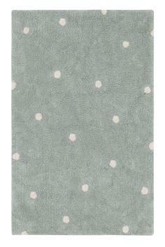 a gray rug with white dots on it