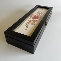 a black box with a floral design in it