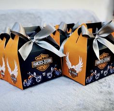 two harley davidson gift boxes with silver ribbons