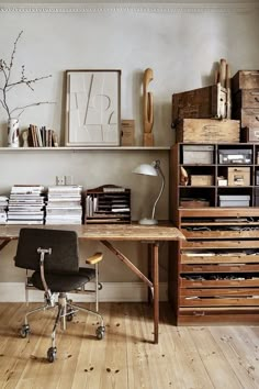 an office with lots of drawers and desks in the corner, including a chair