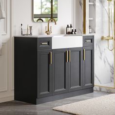 a white sink sitting under a mirror in a bathroom