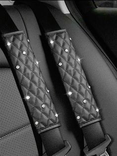 the seat belt covers are decorated with sparkling lights and studded in silver metal beads