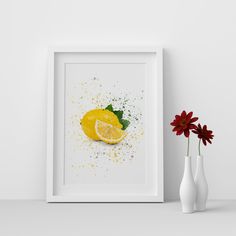 a white vase sitting next to a yellow lemon