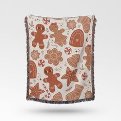 a brown and white blanket with gingerbreads on it