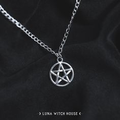 The traditional pentagram star - it's what any witch would want on a necklace! This is a beautiful gothic fashion statement! - Material Type: Zinc Alloy - Chain Length: 18 inches - Pendant Size: 2cm All necklaces are inside a material pouch and then carefully placed inside an envelope lined with bubble wrap to ensure no damage in transit. *Please note that although item photography is as accurate as possible, some screens may portray the item colour slightly different to the colour in person. By browsing this shop or placing an order, you agree not to copy, resell or duplicate the product. This includes all illustrations as well as the representation of products. All work is intellectual property of Luna Witch House which will lead to infringement if exploited or violated. This work is sub Gothic Silver Jewelry With Star Charm, Gothic Star-shaped Metal Necklace, Witch Necklace Pendants, Item Photography, Witch Accessories, Gothic Mode, Gothic Jewellery, Pentagram Necklace, Witch Necklace