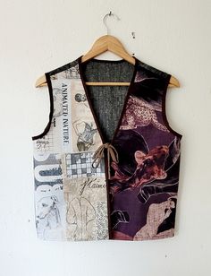 a vest made out of different types of clothing hanging on a wall next to a wooden hanger