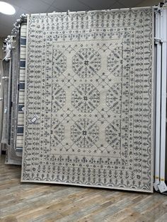 a large rug is on display in a store