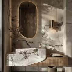 a bathroom with marble counter tops and a round mirror on the wall, along with an oval light fixture