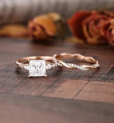 two wedding bands with a princess cut diamond