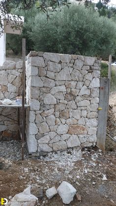 a stone wall is built into the ground