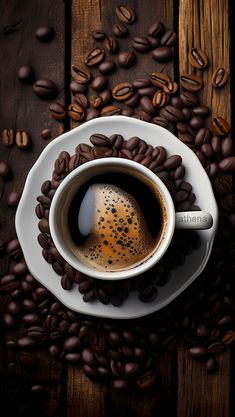 a cup of coffee surrounded by coffee beans