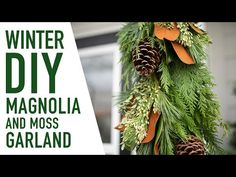 a christmas tree with pine cones and evergreen leaves hanging from it's branches, in front of a house