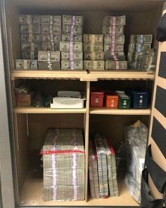 a shelf filled with stacks of money and bags