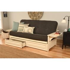 a futon couch with drawers underneath it