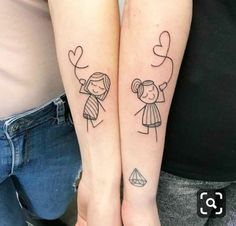 two people with matching tattoos on their arms