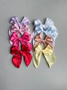 "Hair bows are the cutest hair accessory! Bows are made with removable clips on the right side but the clips can be removed to be used on the left side! If you would like clip on left please add to notes at checkout! Bows will be sewn in the center to help them not come untied if a child pulls on it. You may see a tiny bit of string by the clip or headband but don't worry about it.  Bow Measurements: Vera: 4.5\" by 5\" Alligator Clip Sizes: 2.35\" alligator clip teeth 1.9\" alligator clip Please Adjustable Hair Accessories With Decorative Bow For Spring, Pink Satin Bow Hair Accessories For Spring, Spring Bows, Pink Hair Bow Accessories For Spring, Easter Hair Bows, Bow Measurements, Cute Adjustable Hair Accessories With Pink Bow, Cute Adjustable Pink Bow Hair Accessories, Easter Hair Bow