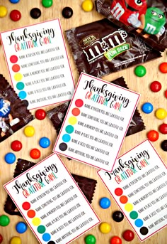 some candy bars are sitting on top of a table with the names of their different flavors