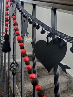 a set of stairs decorated with red, black and white decorations for valentine's day