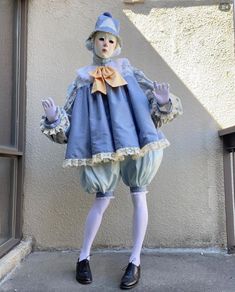 a mannequin dressed in blue and white clothes