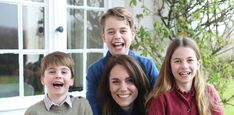 a group of people that are standing in front of a window with their mouths open