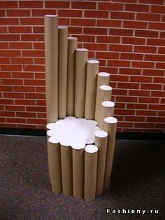 several rolls of toilet paper sitting in front of a brick wall with white circles on them